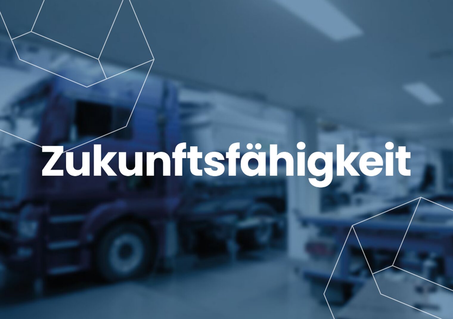 Zukunftsfähigkeit Das Wort "Zukunftsfähigkeit" in weiß auf einem abgedunkelten Foto der Kfz-Werkstatt im bbz Arnsberg.